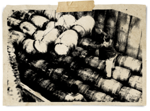 Photo of old barrels on ship.=